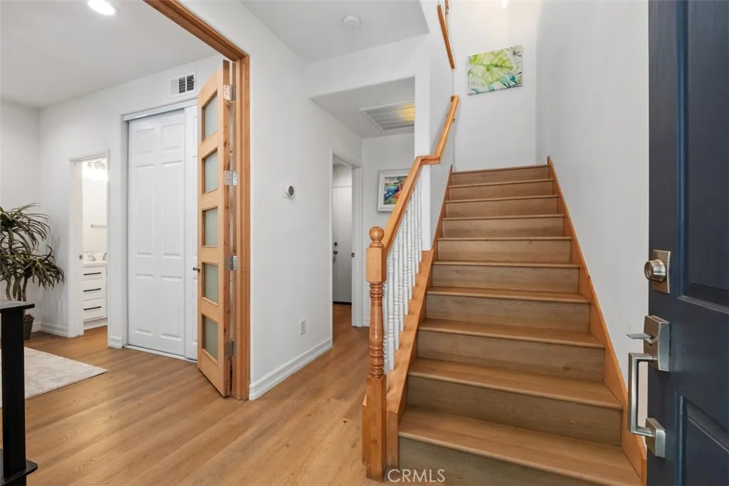 On the left side of the entrance, there is a suite bedroom and a private patio.