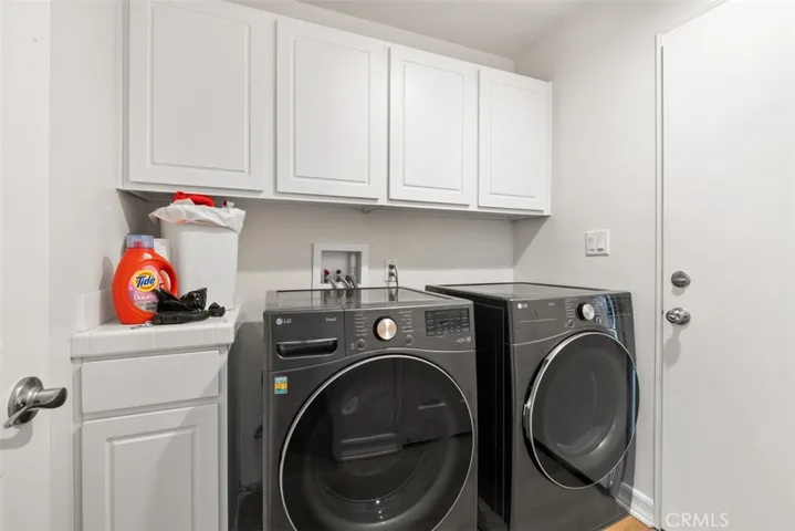 laundry and dryer on first floor next to garage
