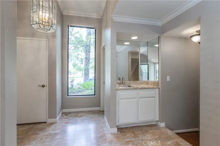 Foyer with powder room, closet and wet bar