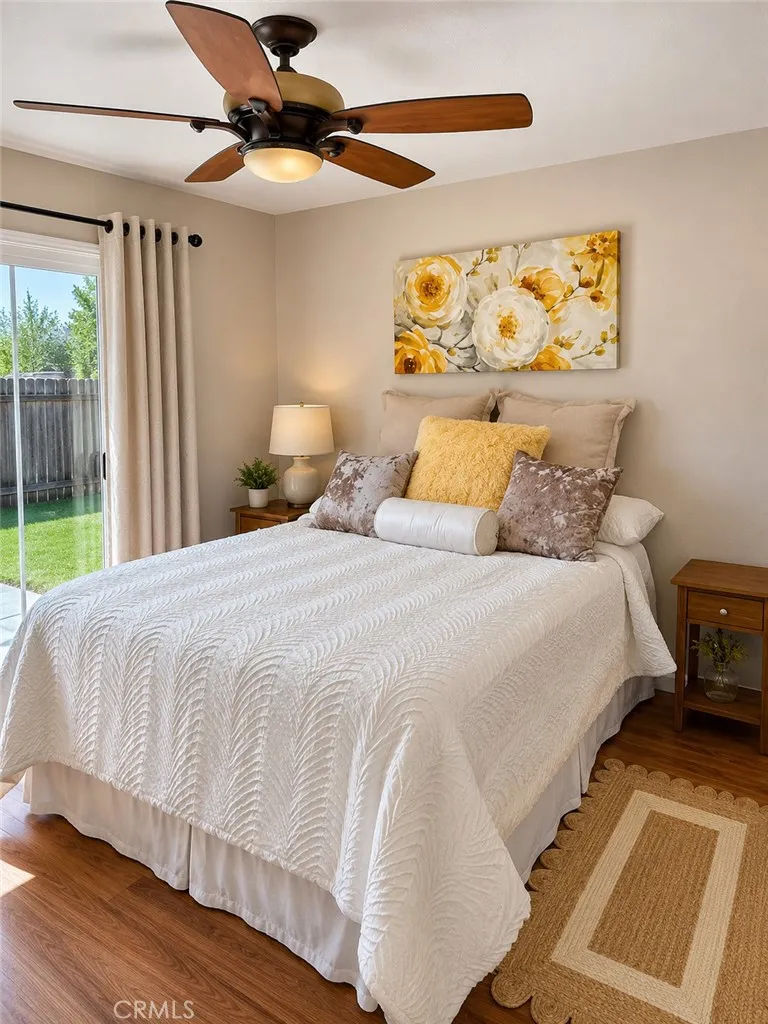 Main house Bedroom with new paint, fan and slider
