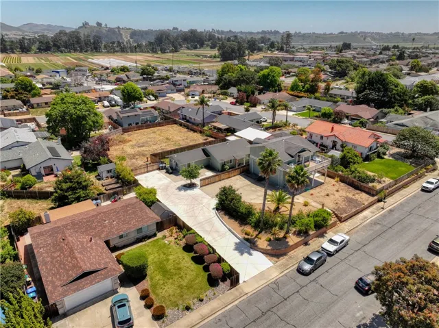 Two lots with 2 APN's The first lot currently has two permitted residences.  Current Owner has installed a new concrete driveway as well as a beautiful gate separating the two lots. The first lot is 13,504 square feet and the second lot is 11,214 square feet, totalling ove a half acre!
