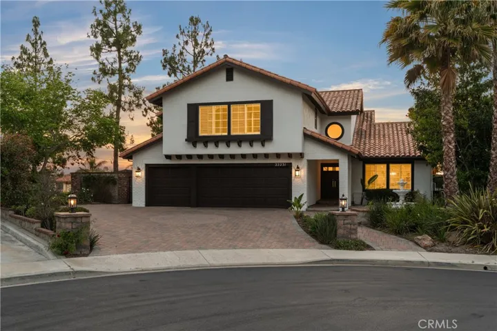 Set on a quiet cul-de-sac, featuring elegant curb appeal, a spacious paver driveway, and a welcoming entry.