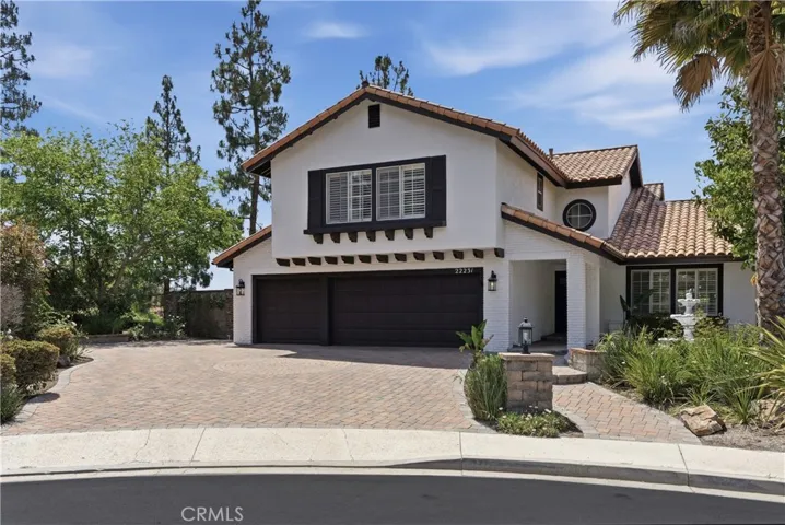Set on a quiet cul-de-sac, featuring elegant curb appeal, a spacious paver driveway, and a welcoming entry.