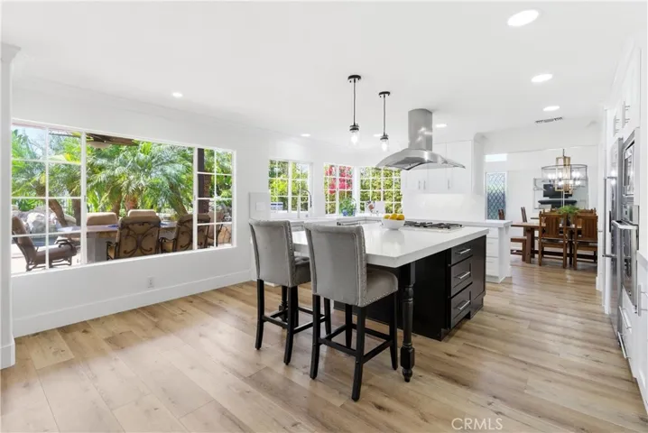 Bright kitchen with quartz countertops, farmhouse sink, and serene garden views.