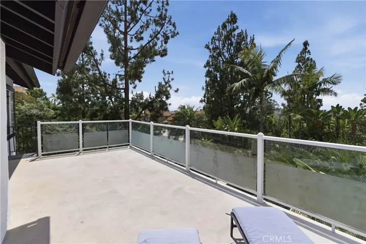 View deck showcasing panoramic mountain and city lights views.