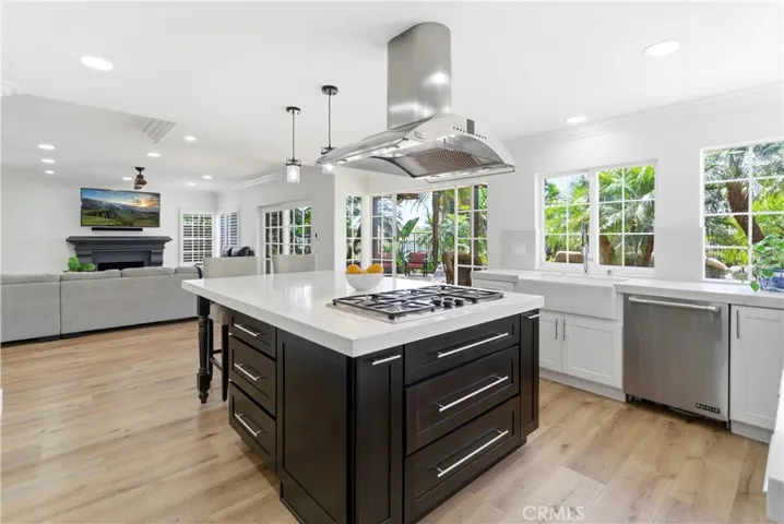 Beautifully updated kitchen featuring a spacious island, stainless steel appliances, and open-concept living.