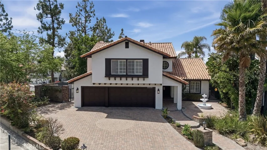 Set on a quiet cul-de-sac, featuring elegant curb appeal, a spacious paver driveway, and a welcoming entry.