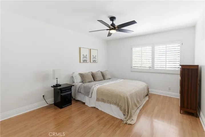 Spacious bedroom with abundant natural light.