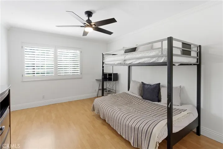 Spacious bedroom with abundant natural light.