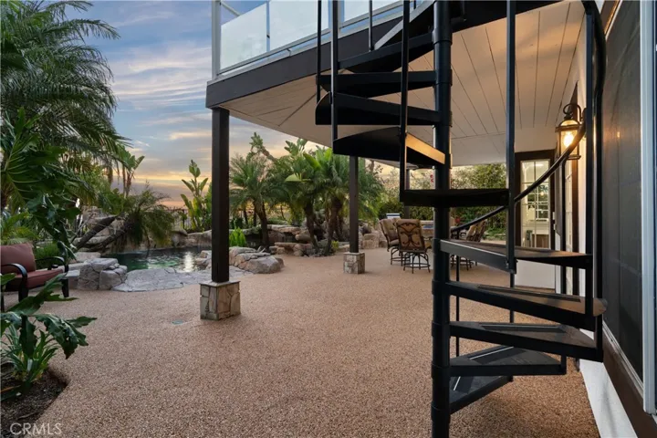 Entertainer’s backyard with multiple seating areas and a newer built-in BBQ.