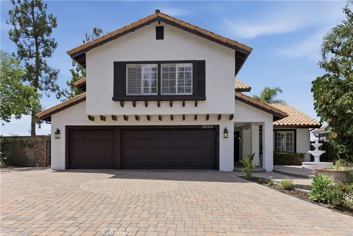 Set on a quiet cul-de-sac, featuring elegant curb appeal, a spacious paver driveway, and a welcoming entry.