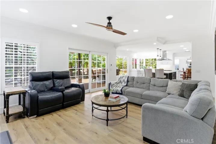 Inviting living room centered around a stylish fireplace with abundant natural light.