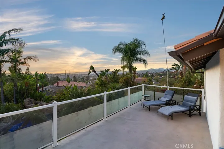 View deck showcasing panoramic mountain and city lights views.