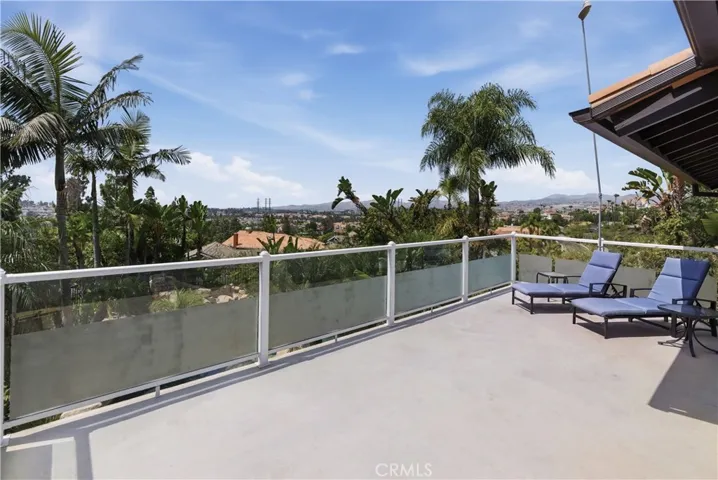 View deck showcasing panoramic mountain and city lights views.