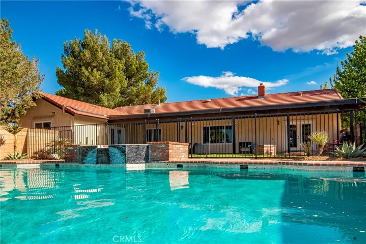 view of the pool and covered patio