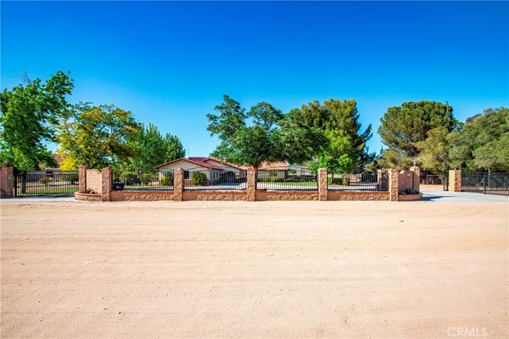 dirt street and view of home