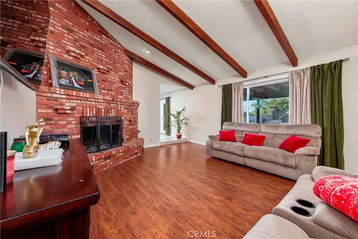 2nd view of formal living room with fireplace