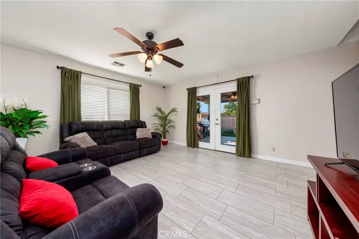 family room  doors leading th the pool area and covered patio.