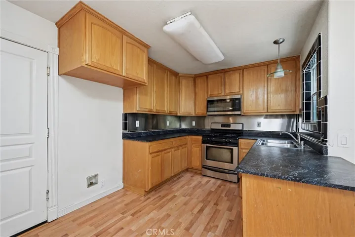 Kitchen has door to garage.