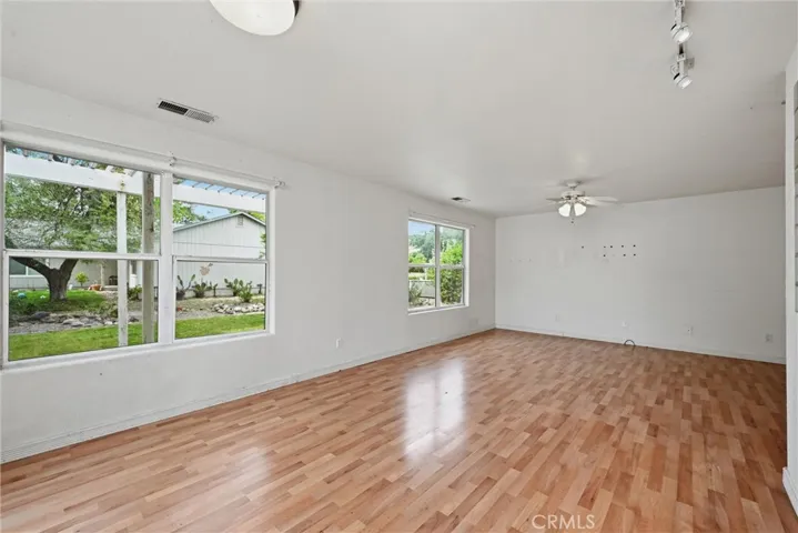 Dining area looking toward living area.  Has nice views of the backyard.