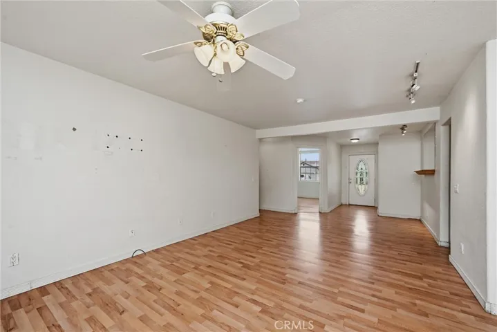 Living area looking toward bedroom 2 and front entry.