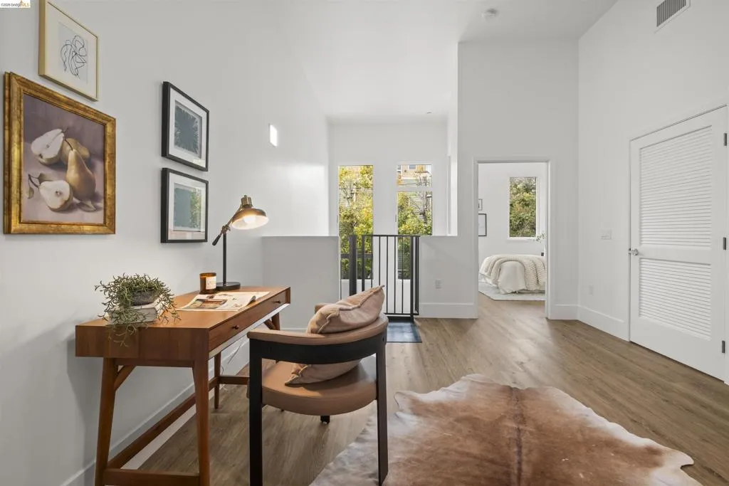 Home office with wood finished floors and baseboards