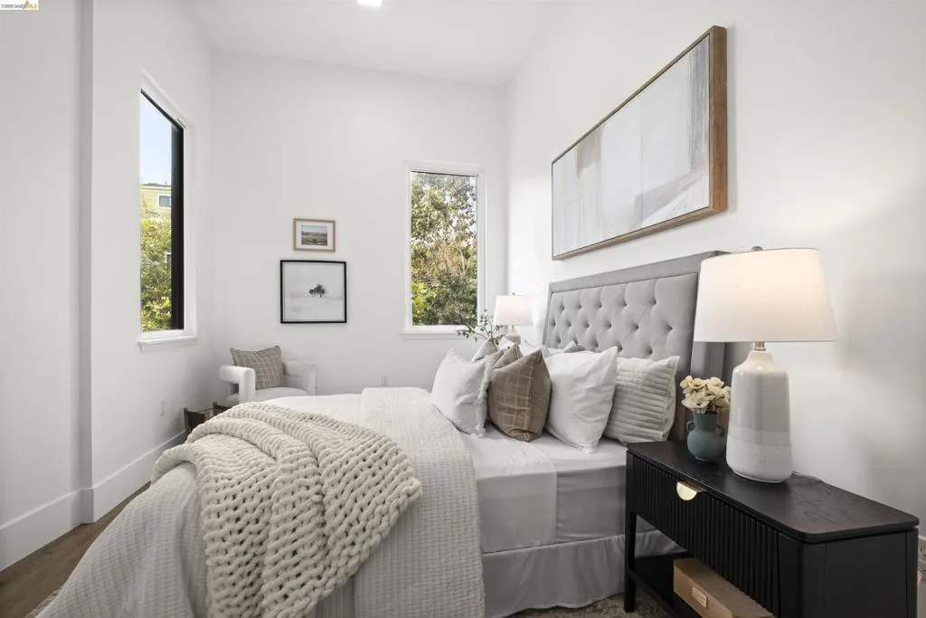 Bedroom featuring baseboards and wood finished floors