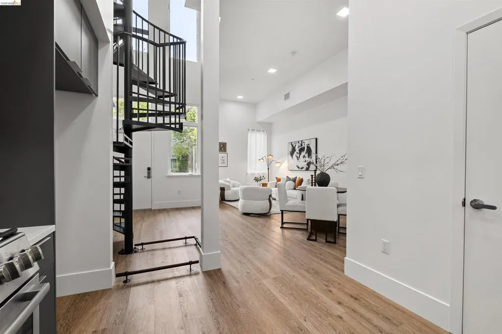 Entrance foyer featuring light wood finished floors, recessed lighting, stairway, and a high ceiling