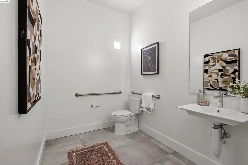 Bathroom featuring baseboards and light tile patterned flooring
