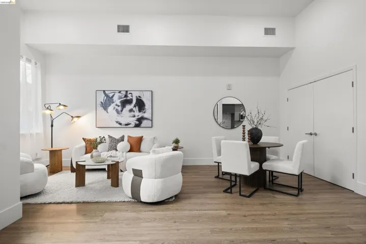 Living area with wood finished floors and baseboards