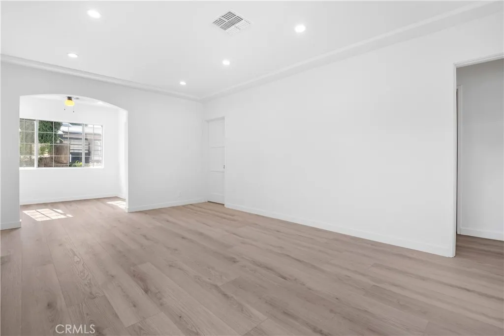 Spacious living room with adjacent dine area