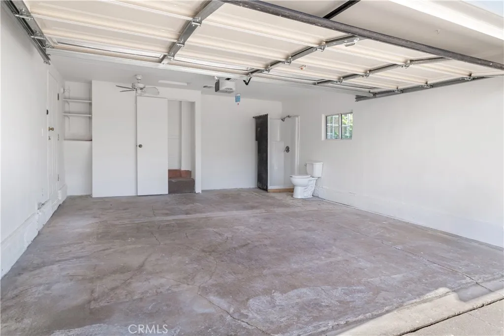 Drywalled & painted garage. Has stall shower & toilet.