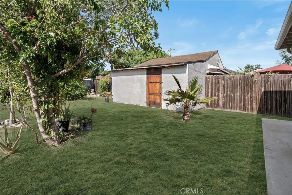 1x of the work sheds on the east side of the yard (grass has been AI generated)