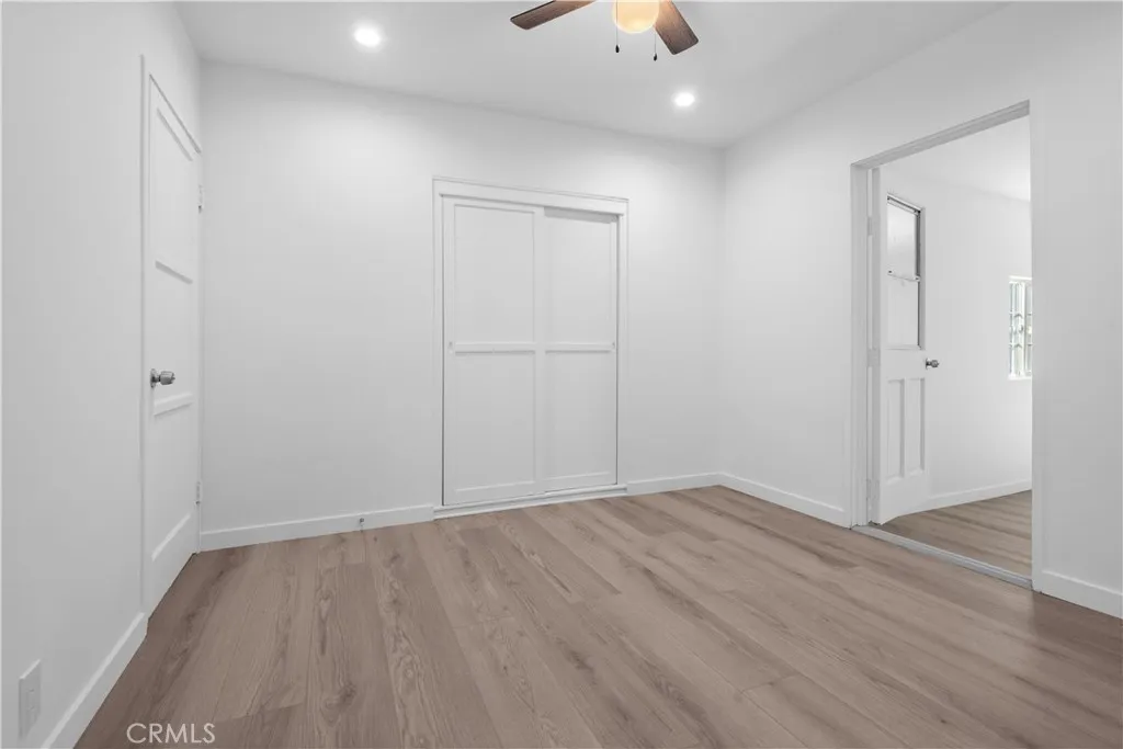 Bedroom 2 and doorway leading to added bonus room