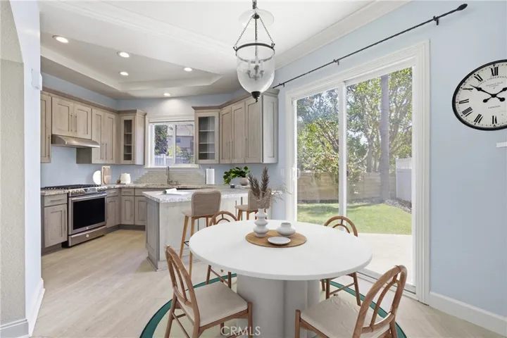 Dining nook with slider to back yard.  Virtually staged.