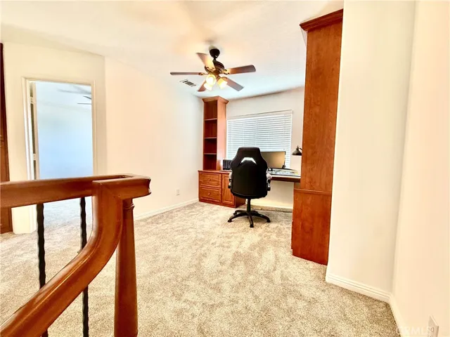 Loft office with built-in cabinetry