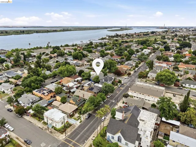 Aerial perspective showcasing a residential neighborhood with mature trees