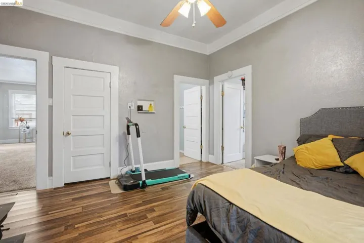 Wood-finish flooring and high ceilings with crown molding