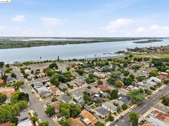 Aerial perspective showcasing a residential area with a prominent waterfront
