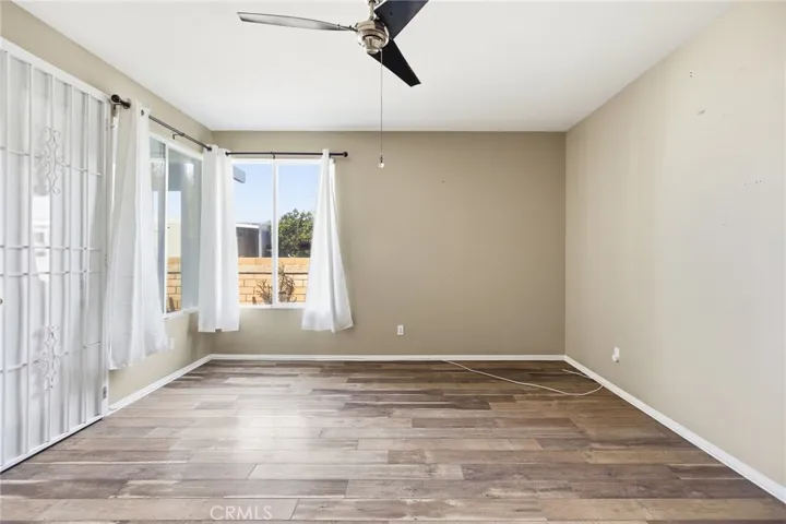 Primary Bedroom with Doorway to Enclosed Patio