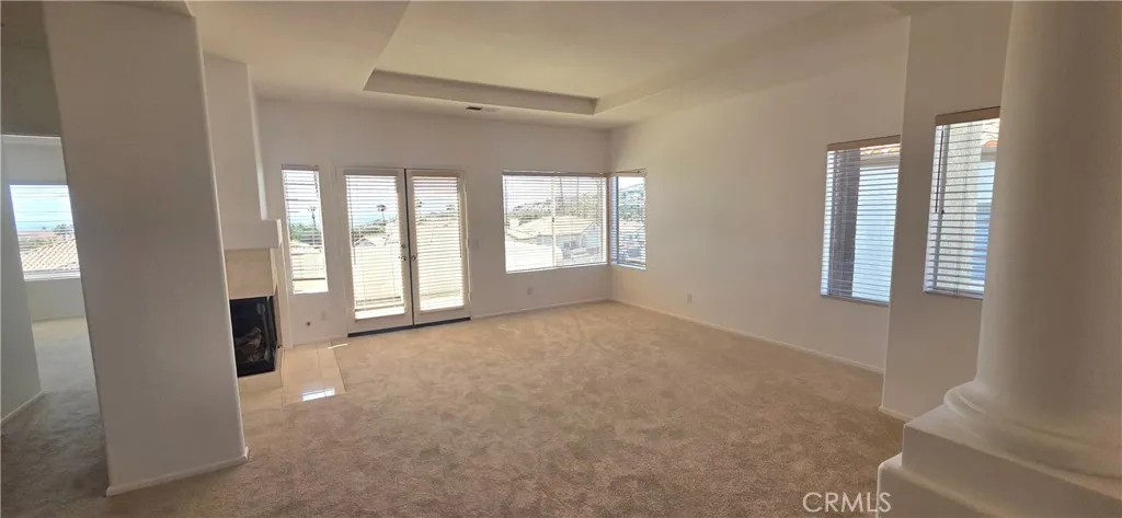 Living room with Main Bedroom entry to the left.