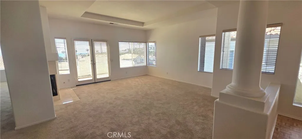 Entry into unit from the right leads into the open living room.