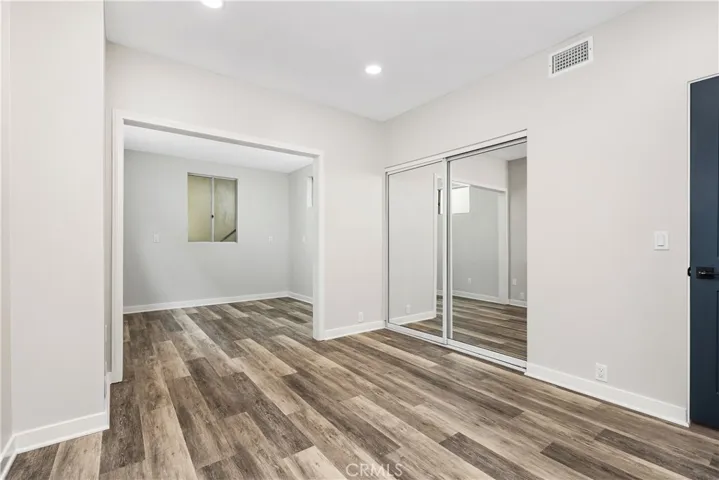 Secondary bedrooms are spacious. One with an added bonus area, the other with a sliding glass door to the side yard.