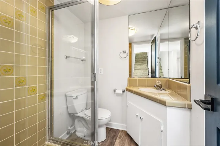 Guest bathroom is quaint from early days.