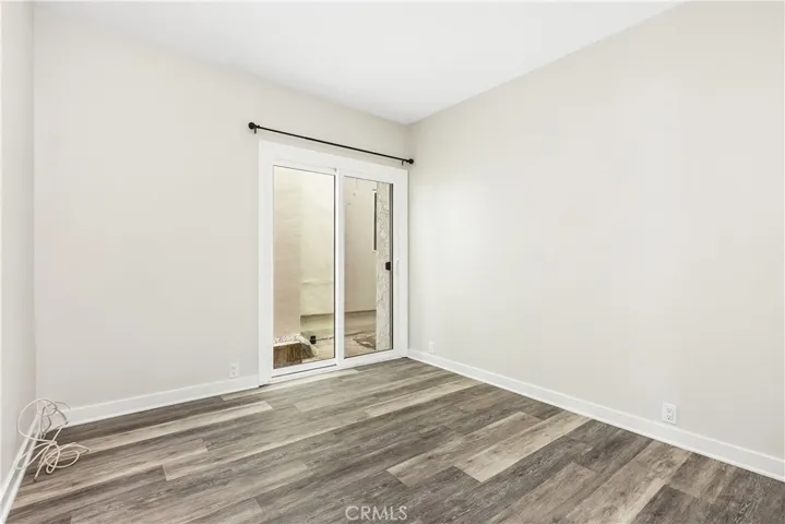Secondary bedrooms are spacious. One with an added bonus area, the other with a sliding glass door to the side yard.