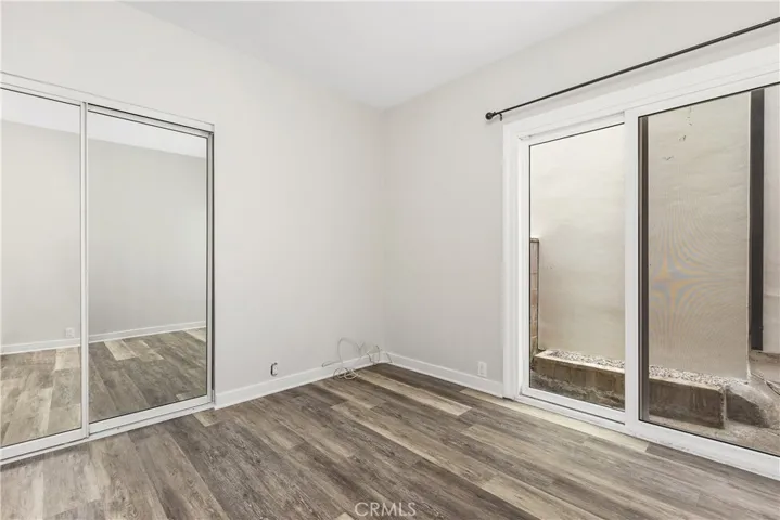 Secondary bedrooms are spacious. One with an added bonus area, the other with a sliding glass door to the side yard.