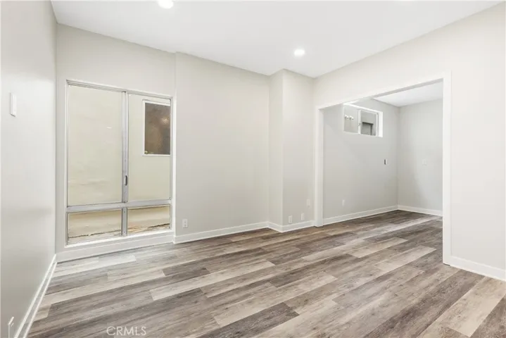 Secondary bedrooms are spacious. One with an added bonus area, the other with a sliding glass door to the side yard.