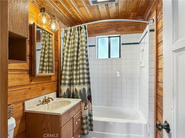 Bathroom with rich wood paneling