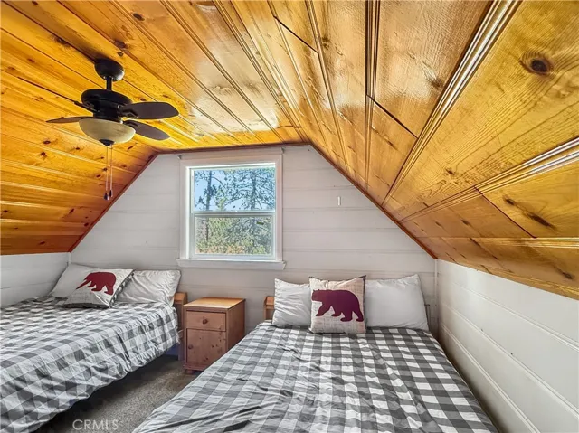 Upstairs Bedroom/Loft fits two full-sized beds & has spacious storage