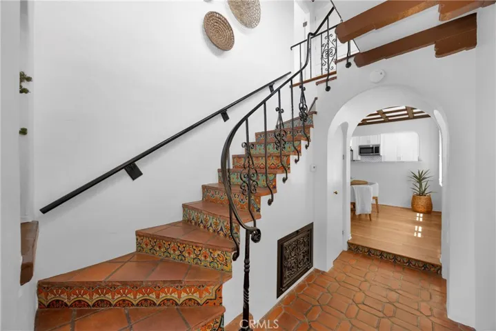 Beautiful Spanish character and charm with original tile leading up the stairs